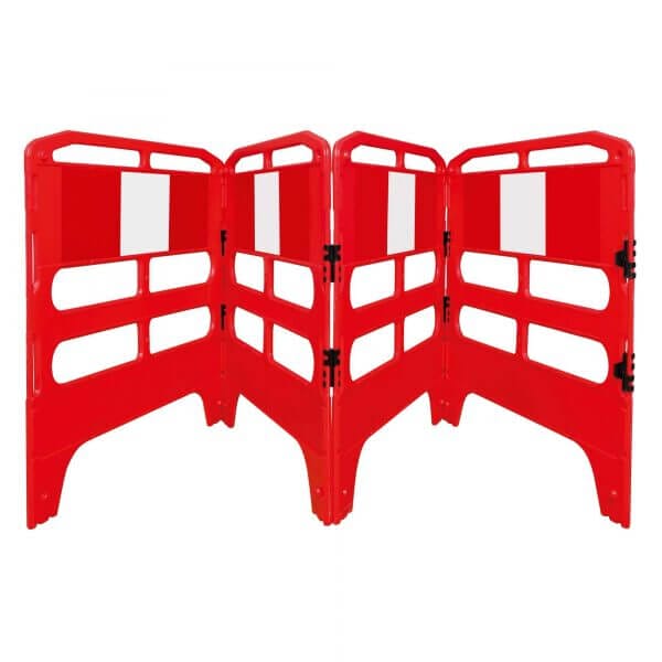 Vier rote MORION Schachtschutzgitter aus Kunststoff im Zickzack mit weißen Reflektorstreifen, Baustellenabsicherung.